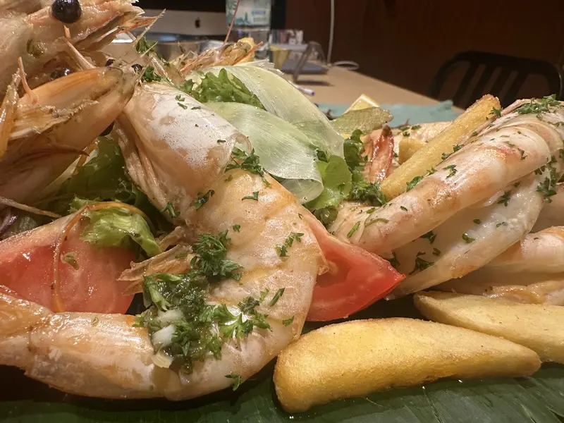 Grilled prawns with fries and salad