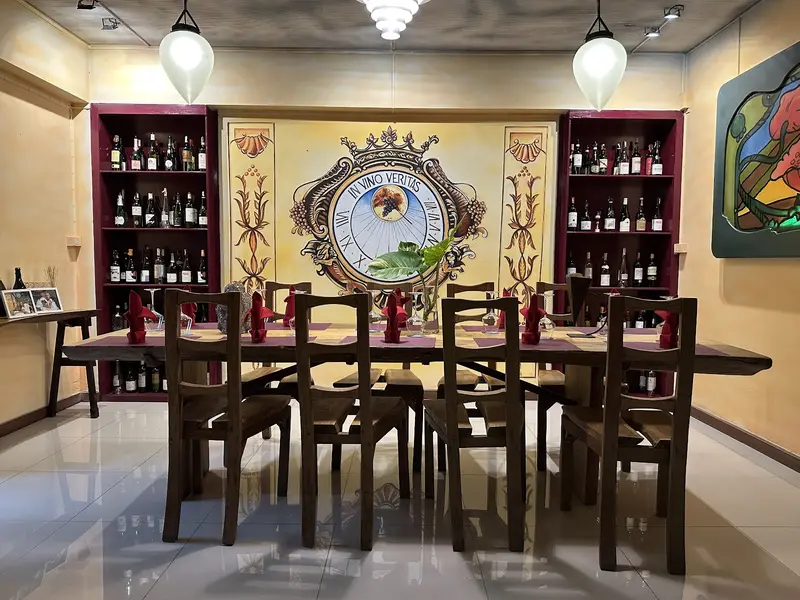 Private dining table in front of the wine shelves